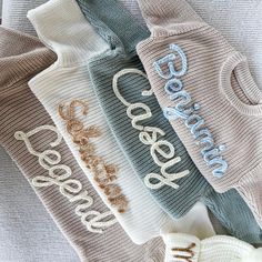 four pairs of socks with the word god written on them