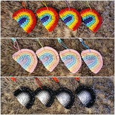 crocheted heart ornaments are arranged in four different colors and sizes, including rainbows