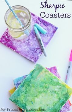 some crafting supplies are sitting on top of a table with the words sharpie coasters