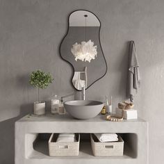 a white sink sitting under a mirror next to a towel rack and other bathroom accessories