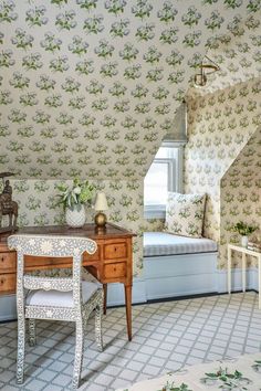 an instagram photo of a bedroom with floral wallpaper and a desk in the corner