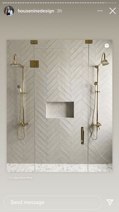 a bathroom with white tile and gold fixtures on the shower wall, along with a glass door