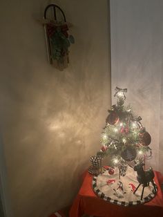 a small christmas tree on top of a table