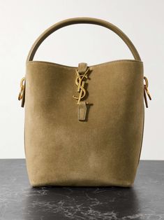 Shop SAINT LAURENT Le 37 small suede bucket bag, Explore the latest SAINT LAURENT women's collection today on NET A PORTER Ysl Suede, Suede Bag, Raffia Bag, Ski Wear, Soft Suede, Gold Tone Metal, Women Collection, Jeans And Boots, Mini Bag