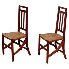 two wooden chairs sitting next to each other