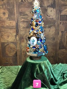 a christmas tree made out of beads and other items