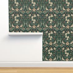 an image of a wallpaper design with flowers and leaves on green background in the corner of a room