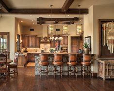 a large kitchen with wooden floors and lots of counter space