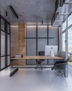 an office area with a desk, chair and laptop on the table in front of large windows