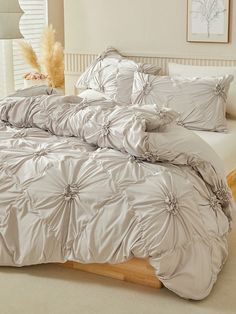 the comforter is made up and ready for someone to use it in their bed