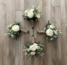 four bridal bouquets arranged on the floor