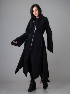 "Asymmetric Extravagant Maxi Winter Coat with Pockets. High Collar Draw String Adjustable Waist.Relaxed loose flared hem. Medieval Fairy sleeve and metal ring details. ^ Sizes: The item can be made in sizes from XXS to 7XL. Please, use the size chart below or if you are not sure about your size, just * contact us with your measures! ^ Estimated delivery times: It takes us up to 3 days to make and ship this item.  Standard delivery: - 10-15 biz days to the US, Canada  - 5-7 days to Europe - 15-20 Fairy Sleeve, Medieval Fairy, Gothic Winter, Coat Plus Size, Princess Coat, Gothic Outfits, Metal Ring, Casual Coat, Long Black