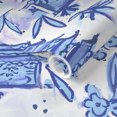 an artistic blue and white wallpaper with paint splattered on it's surface