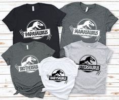 three t - shirts with dinosaurs on them and the words,'babysauruss '