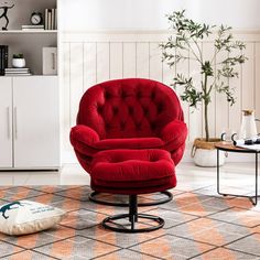 a red chair and ottoman in a living room