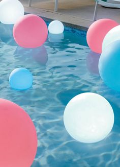 an inflatable ball floating on top of a swimming pool