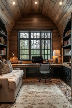 a room with a couch, desk and bookshelf in it's center