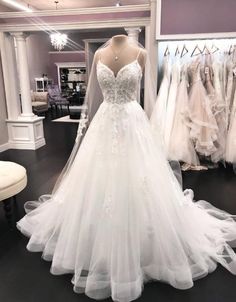 a wedding dress on display in a store