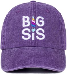 a purple hat with the word big sis on it and a rainbow heart in white letters