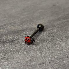 Black Classic Ladybug Top End Barbell Tongue Ring - Surgical Grade Stainless Steel - Body Candy Black Tongue Piercing, Cool Tongue Rings, Cute Tongue Rings, Tongue Piercing Jewelry, Tongue Piercings, Rwby Oc, Black Tongue, Tongue Ring, Face Piercings