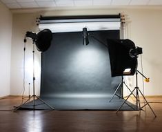 an empty photo studio with lighting equipment