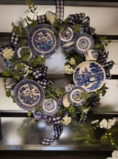 a wreath with blue and white plates on it