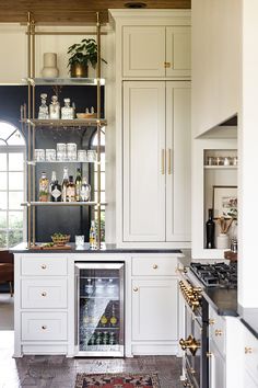 the kitchen is clean and ready to be used as a home bar or wine cellar