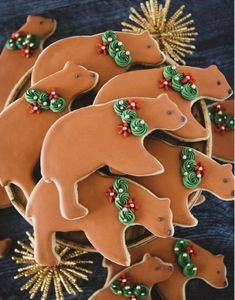 decorated cookies in the shape of bears on a table