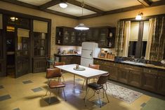 the kitchen is clean and ready to be used for cooking or dining room furniture, as well as other appliances