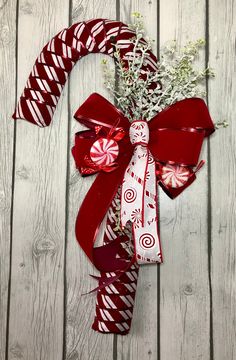 a candy cane wreath on top of a wooden table