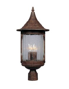 an old fashioned light fixture with three lights on it's sides and a small candle in the center