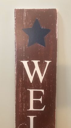 a wooden sign that says we love texas with a blue star on the top and white letters