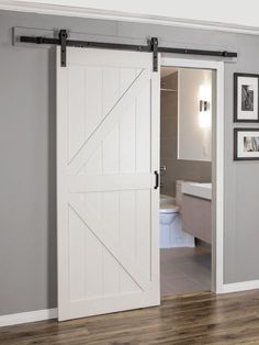 an open sliding barn door in a bathroom