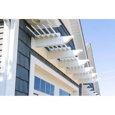 a white stair case on the side of a house