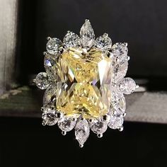 a fancy yellow diamond ring with white diamonds