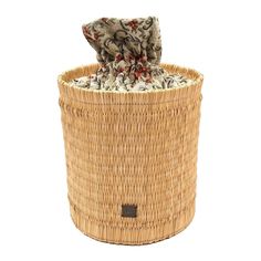 a woven basket with a cloth in it