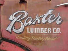 an old rusted truck with the words baxter'lumber co painted on it