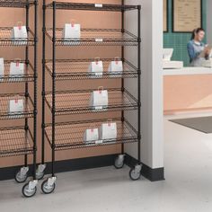 two shelving units with shopping bags on them