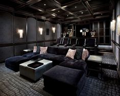 a large black couch sitting in a living room