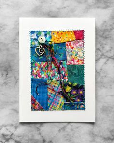 a card with an image of a colorful patchwork design on the front and back