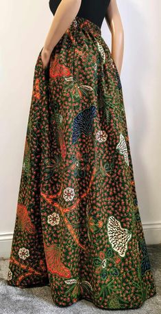 Handmade Unlined African Print Maxi / Full-Length Skirt     Elastic waistband skirt at the back     2 open side-entry pockets     Length: 46" (adjustable)     100% Wax Cotton     Handmade     Made in the UK (Colours may vary due to lighting on images. The product images are closest to the true colour of the product.) Green Flared Wrap Skirt With Lining, Full Length Lined Green Maxi Skirt, Green Full Length Lined Maxi Skirt, Fitted Green Maxi Skirt With Pockets, Traditional Multicolor Spring Maxi Skirt, Skirt Wax, Traditional Multicolor Maxi Skirt, Black Jacquard Flowy Long Skirt, Chitenge Skirts High Waist Long