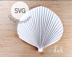 a white fan sitting on top of a wooden table next to a sign that says svg