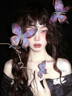 a woman with butterflies on her hair