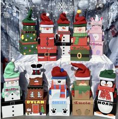 a table topped with lots of boxes covered in christmas decorations