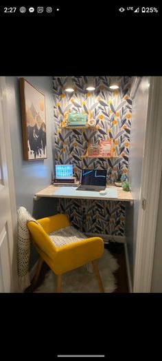 a yellow chair sitting in front of a desk