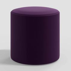 a purple stool sitting on top of a white floor