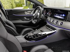 the interior of a mercedes s - class coupe with blue trims and steering wheel controls