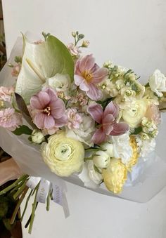 a bouquet of flowers sitting on top of a table