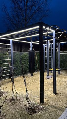 an outdoor gym is lit up at night