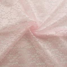 a pink lace fabric with small flowers on it